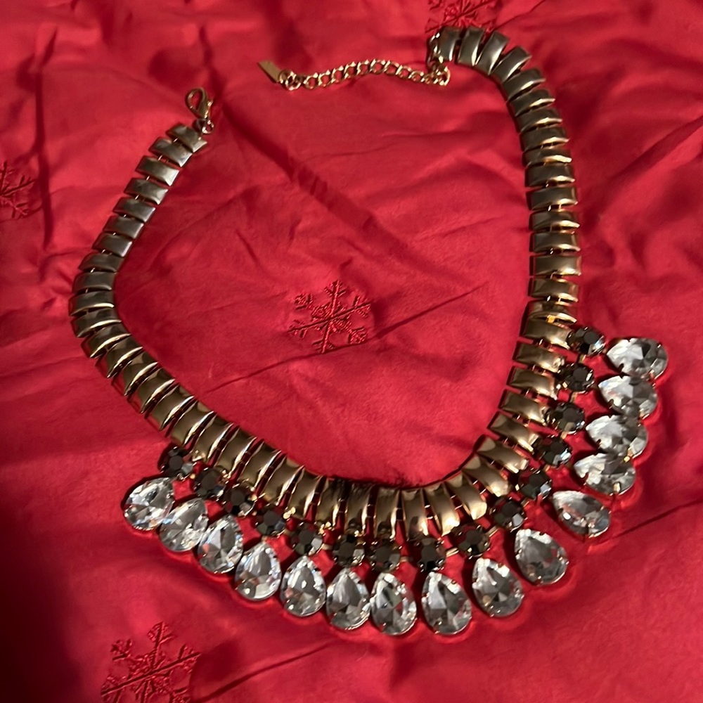 Gorgeous necklace,great quality.Gold color with gray and white rhinestones